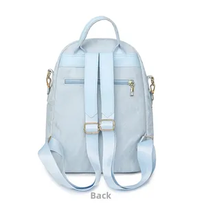Detail view of the back of a light blue oxford backpack featuring an anti-theft zipper pocket