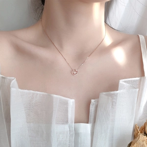 Elegant rose gold S925 sterling silver asteroid necklace worn on a woman's collarbone