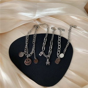 Vintage silver rabbit bracelet with Good Luck charms on a heart-shaped display pad