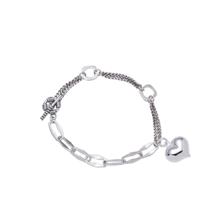 925 silver heart bracelet with asymmetric chain and toggle clasp on white background