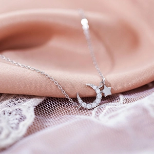 Elegant 925 sterling silver necklace with sparkling moon and star pendants for women