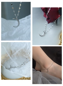 Macro shot of S925 silver crescent moon anklet with cubic zirconia and sequin chain