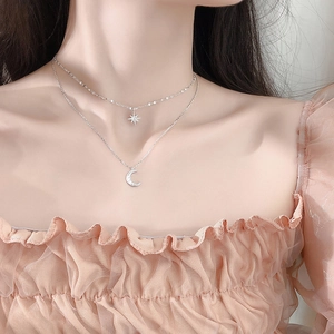 Double-layered 925 silver necklace with sparkling star and crescent moon pendants