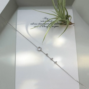Detailed close-up of 925 sterling silver geometric circle anklet with micro-pave crystals