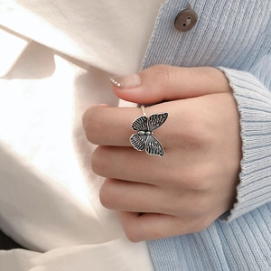 Vintage 925 sterling silver butterfly open ring with detailed wings on female hand
