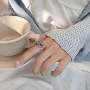 Detailed view of a vintage 925 silver butterfly ring featuring intricate wing textures
