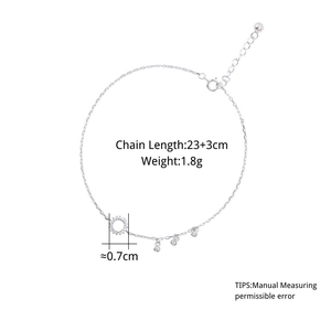 Detail of 925 sterling silver anklet with geometric rings and sparkling crystal charms
