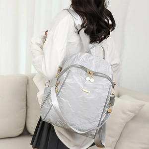 Silver oxford fabric backpack with unique pleated texture and metallic finish detail