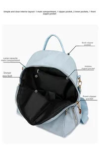 Detail view of Oxford cloth backpack showing main compartment and internal zip pockets