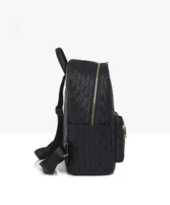 Side view of black PU leather backpack with geometric texture and gold zipper details