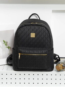Detail view of black PU leather backpack with geometric 3D texture and gold hardware