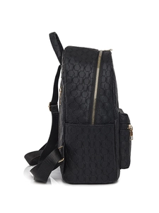 Detail view of black geometric embossed backpack with gold zippers and nylon straps