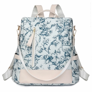 Sac à dos femme en toile de Jouy bleue et blanche avec finitions en cuir beige élégant
