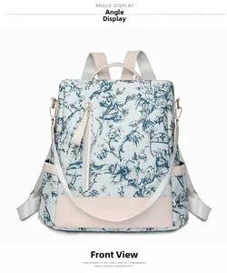Vue de face du grand sac à dos avec imprimé floral bleu vintage et détails en cuir