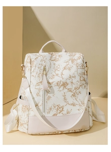 Détail du sac à dos beige de grande capacité avec imprimé floral Toile de Jouy doré vintage