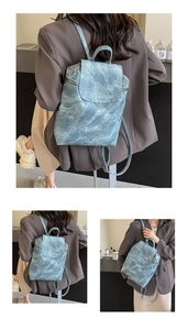 Detail of blue marble textured PU leather backpack with magnetic flap and top handle
