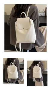 Detail view of a cream white PU leather backpack featuring flap closure and slim straps