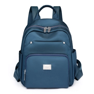Navy blue minimalist backpack with waterproof fabric and multi-pocket functional design