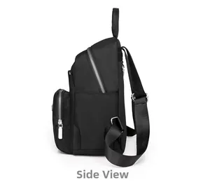 Side view of black minimalist nylon backpack featuring silver zippers and side pocket