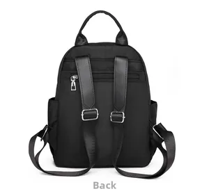 Rear view of black nylon backpack featuring adjustable straps and anti-theft zipper pocket