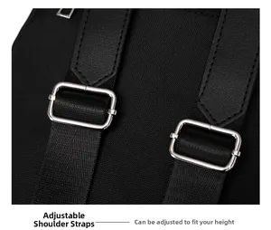 Detail of adjustable nylon shoulder strap with silver metal buckle on black backpack