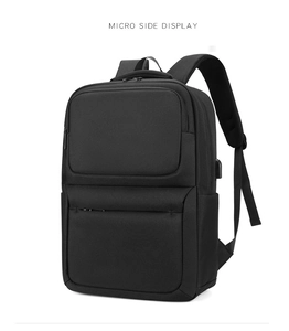 Side view of black business laptop backpack showing USB port and durable fabric