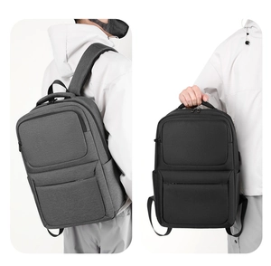 Detail view of large capacity waterproof business laptop backpacks in black and grey colors