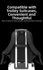 Detail of black laptop backpack with built-in luggage strap for convenient travel attachment