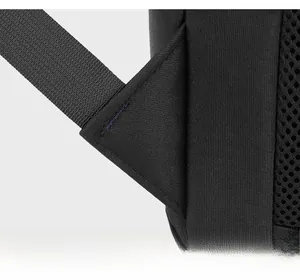 Detail of triangular reinforced stitching and breathable mesh on a black business backpack