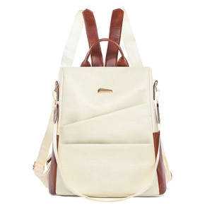 Detail of minimalist two-tone leather backpack with geometric stitching and gold accents