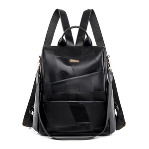 Minimalist black leather patchwork backpack for women with a gold metal hardware accent