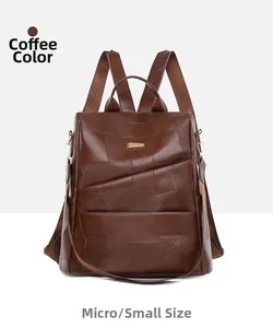 Detail view of coffee brown faux leather backpack featuring trendy patchwork design