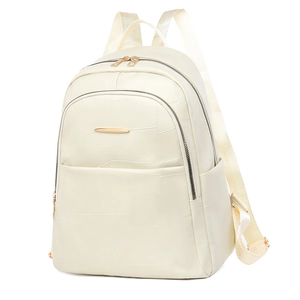 Detail of cream PU leather backpack featuring geometric stitching and gold metal zipper