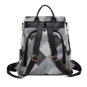 Detail of grey diamond-quilted backpack showing adjustable straps and back view