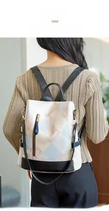 Detailed back view of a geometric quilted anti-theft backpack worn by a model