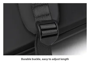 Close-up of padded shoulder straps with adjustable buckle on the black laptop backpack