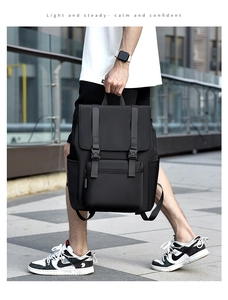 Detail of waterproof black backpack with buckle flap and functional side pockets for men