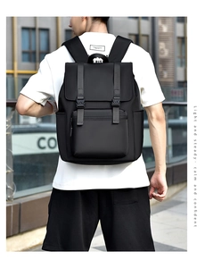 Rear view of a black waterproof nylon laptop backpack with double buckle closure