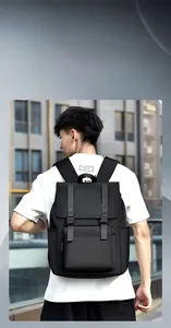 Detail view of water-resistant black backpack with adjustable buckles and matte texture