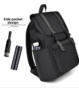 Detail view of side pockets on black laptop backpack holding water bottle and umbrella