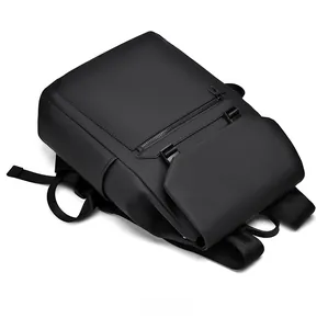 Detail view of the matte black waterproof laptop backpack with geometric top fold design