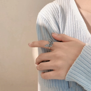 Detailed view of an vintage silver butterfly open ring showing intricate wing textures