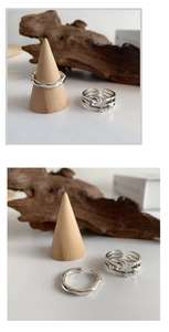 Detailed view of sterling silver star and moon ring with wavy stackable bands