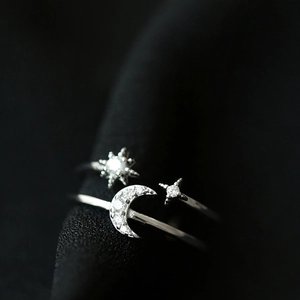 Elegant silver star and crescent moon open ring with shimmering zircon stones