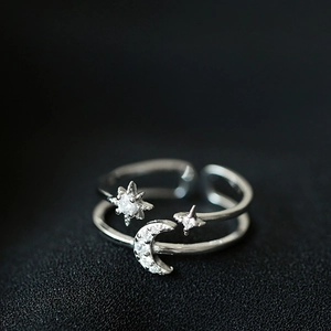 Macro shot of double-layer moon and star open ring with sparkling cubic zirconia inlay