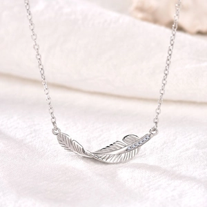 Minimalist S925 sterling silver feather necklace with sparkling cubic zirconia stones