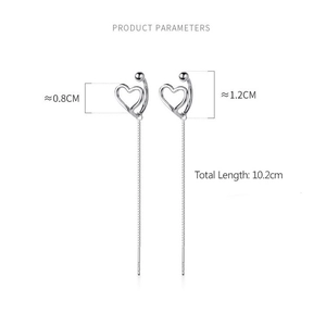Detailed view of silver heart earrings with dimensions and chain length parameters