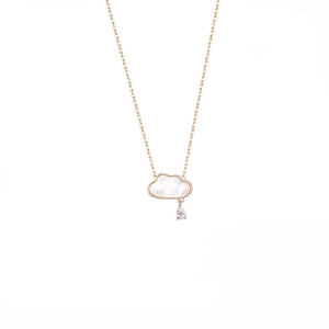 Detail of cloud-shaped mother of pearl pendant with gold plating and teardrop zircon