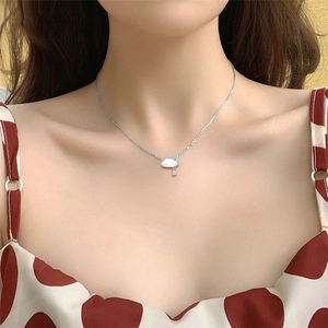 Minimalist cloud necklace with mother of pearl finish and water drop pendant on model
