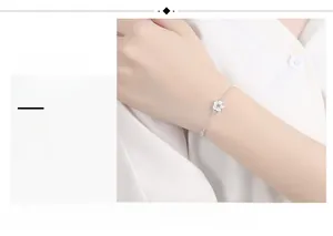 Detailed view of S925 silver cherry blossom bracelet with pink gemstone on model wrist